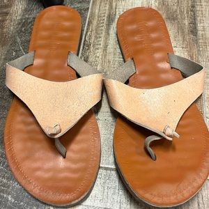Rose gold flip flops